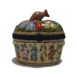 Three Bilston and Battersea enamel trinket boxes, a Meissen porcelain pot and floral cover,