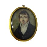 Early 19th century, English School, portrait miniature on ivory of a young gentleman with sideburns,