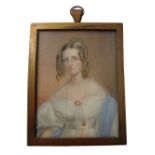 Early 19th century, English School, portrait miniature on ivory of a young lady with ringlets,