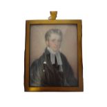 Early 19th century, English School, portrait miniature on ivory of a young cleric with sideburns,