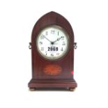 An Edwardian mahogany and inlaid mantel clock,