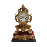 A French ormolu mantel clock, 19th century, the scroll case centred by a white enamel dial,