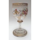 A Bohemian enamelled glass, late 19th century, decorated with flowers, birds and gilt foliate bands,