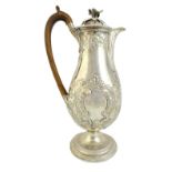 A George III silver hot water jug, of baluster form, with floral,