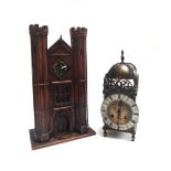 A stained pine cased mantel clock, early 20th century, modelled as a castle gatehouse, 32cm high,
