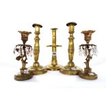 An early 19th century brass candlestick with central circular tier, 25cm high,