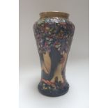 A Moorcroft pottery vase, circa 1997, decorated with stylised oak trees against a polychrome ground,