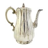 A Victorian silver coffee pot, of baluster form, with a fluted body,