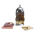 A mid-17th century brass lantern clock case frame,