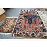 A Turkish prayer rug, the madder mihrab with plants, motifs rising to an arch above,