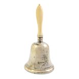 A silver bell, with an ivory handle, Chester 1907, height 12.5 cms, gross weight 101 gms.