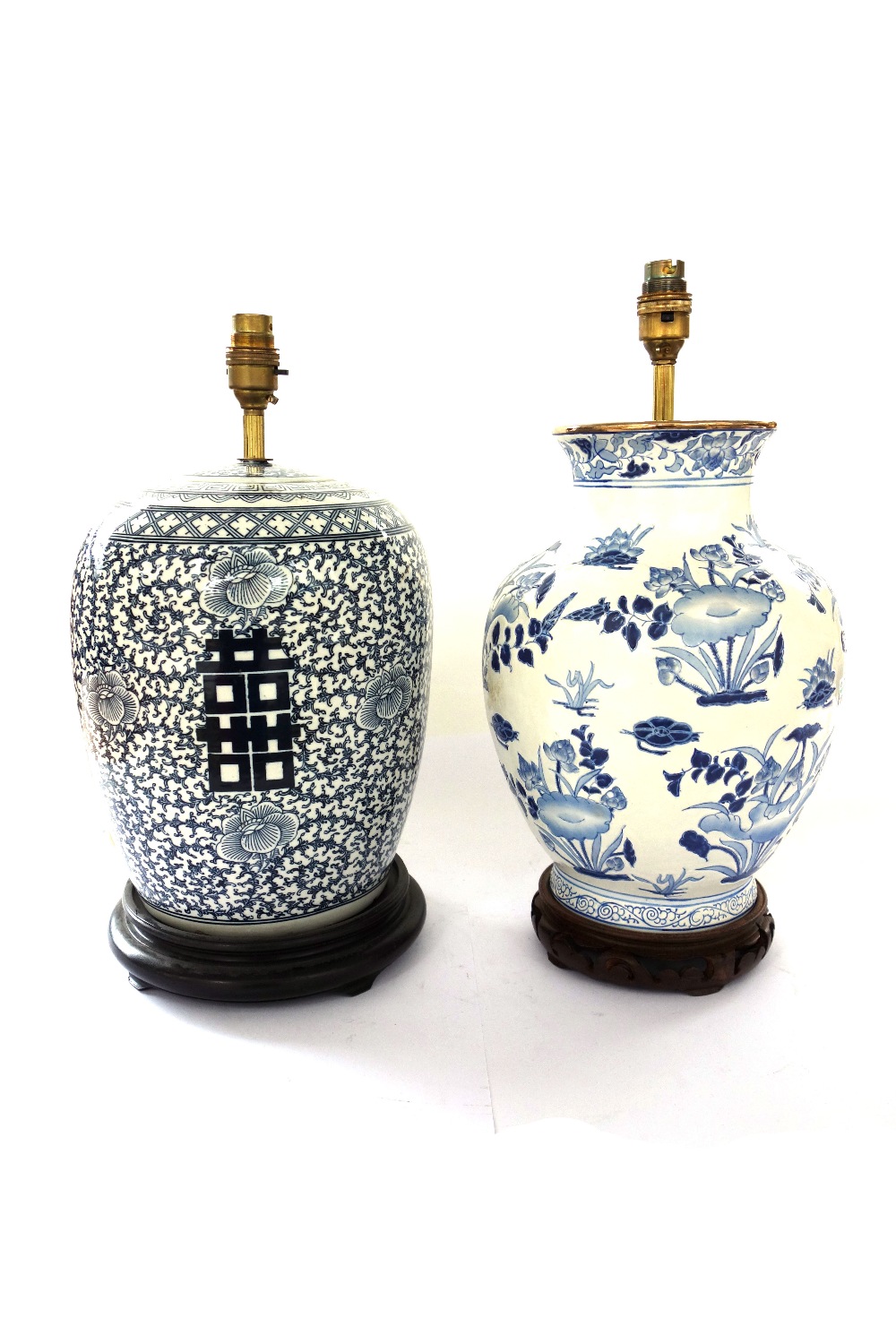 A set of four modern Chinese style pottery table lamps decorated with blue flowers against a white - Image 2 of 3