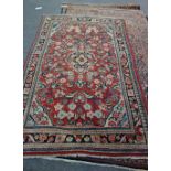 A Mahal rug, Persian the madder field with a black medallion, ivory spandrels,