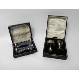 A silver three piece christening set, comprising; a napkin ring, an egg cup and a spoon,