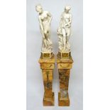 A pair of early 20th century French carved white marble female sculptures set on gilt metal mounted