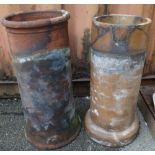 Two terracotta chimney pots and a terracotta plant pot.