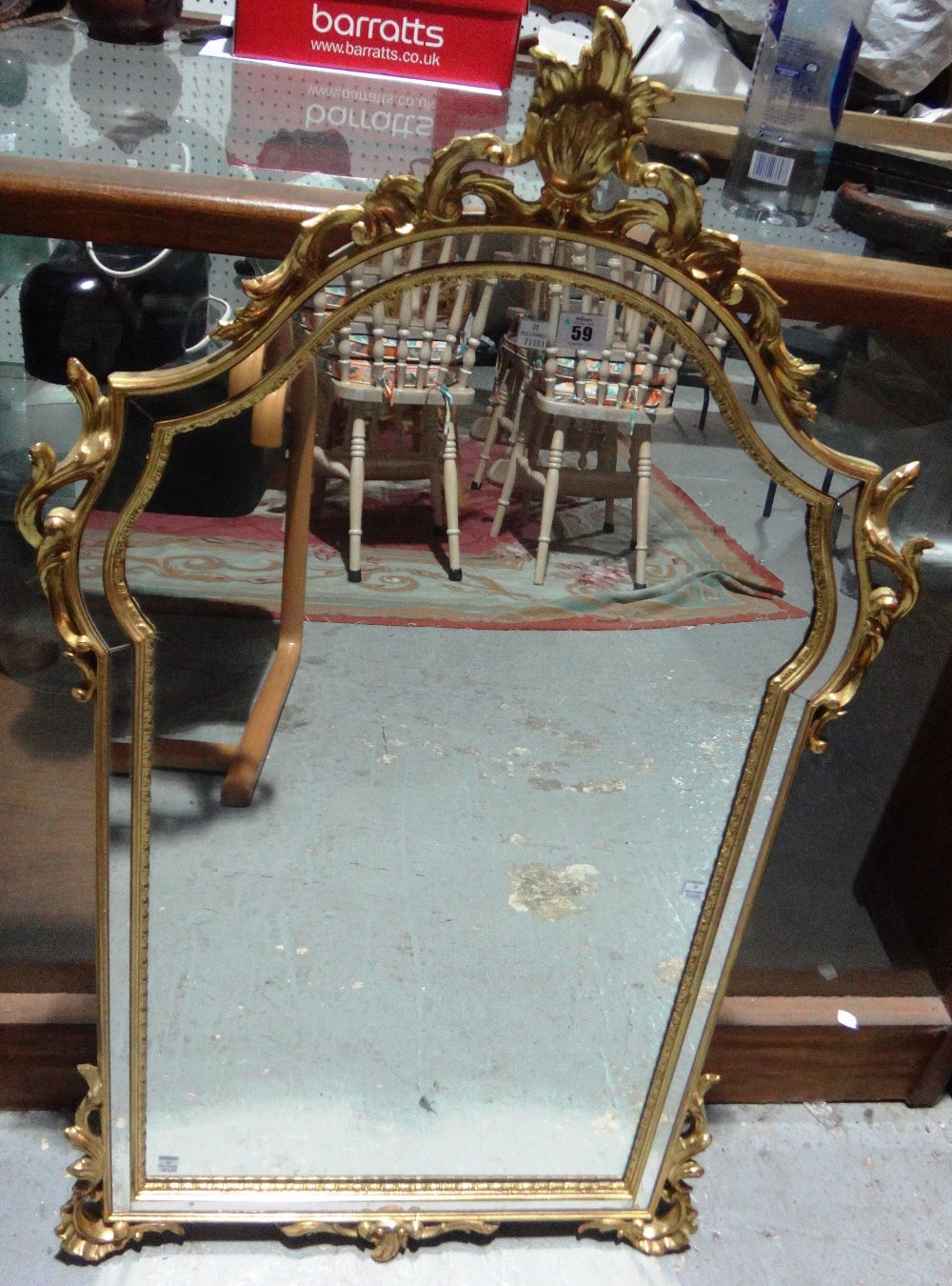 A small gilt framed arch top mirror.