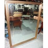 A modern gilt framed wall mirror.