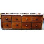 A bank of eight 19th century mahogany drawers with turned handles, 102cm wide.