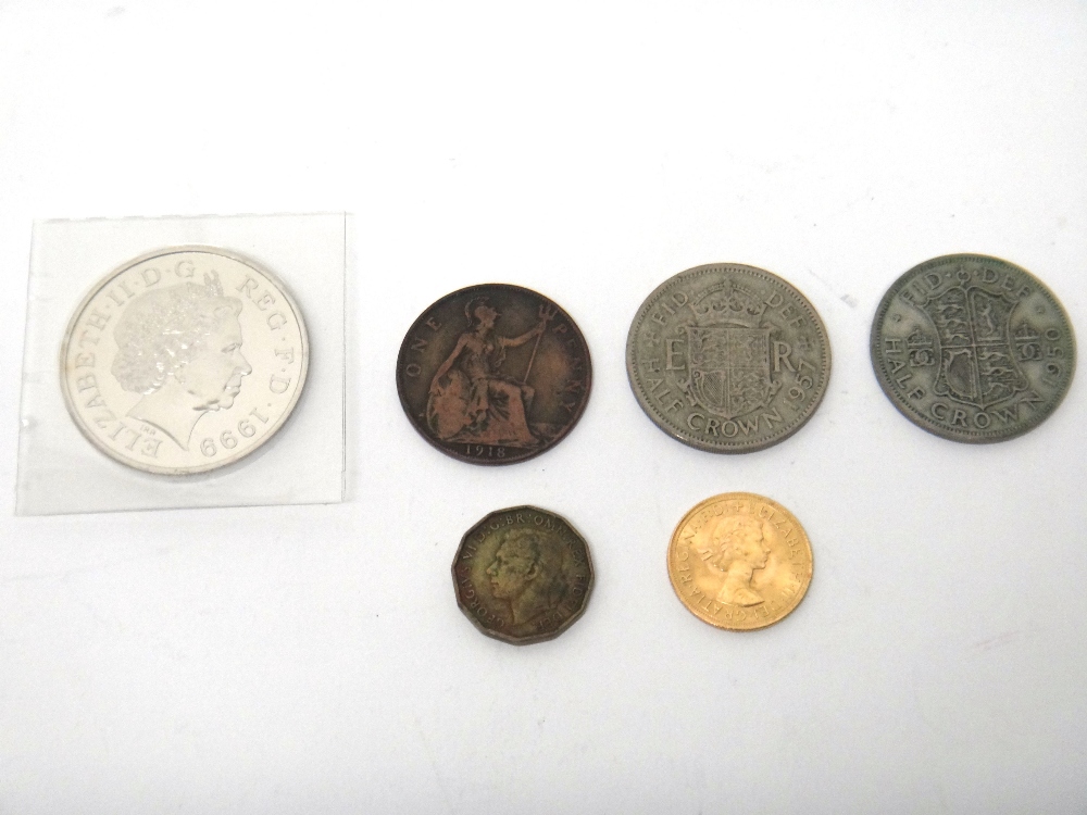 An Elizabeth II sovereign 1963, a five pounds crown 1999 and four further pre-decimal coins.