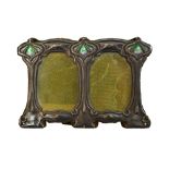 A silver and enamel mounted Art Nouveau twin compartment shaped rectangular photograph frame,