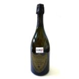 A bottle of Cuvee Dom Perignon 1985 vintage champagne in presentation box.