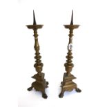 A pair of brass altar candlesticks, 18th century,
