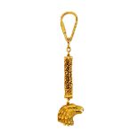 A gold keyring, the terminal designed as the head of a bird of prey,
