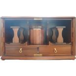 A 20th century Dunhill walnut smoking cabinet, the pair of doors revealing a fitted interior,