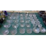 A quantity of Edwardian cut glass finger rinsing bowls and hobnail cut glass salts (a.f) (36).