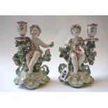 A pair of Derby porcelain figural candlesticks, circa 1770,