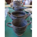 An Etruscan chalice and three Etruscan two handled bowls (a.f), 15cm high (4).