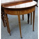 A late 19th century marquetry inlaid mahogany card table on tapering square supports, 77cm wide.