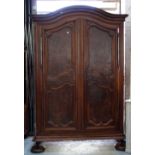 A large 18th century French oak and walnut two door armoire on bun feet, 164cm wide x 258cm high.