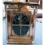 A Liberty's retailed copper and brass veneered hanging corner cupboard in the Art Nouveau style