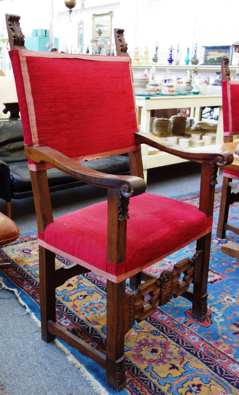 A matched set of six Italian walnut square back chairs, to include a pair of carvers.