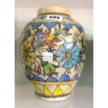 A Qajar vase, of ovoid form painted with a band of flowers in a colourful palette, 20cm. high.