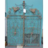 A pair of wrought iron gates, late 20th century, of foliate scroll design,