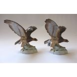 A pair of Herend porcelain birds of prey,
