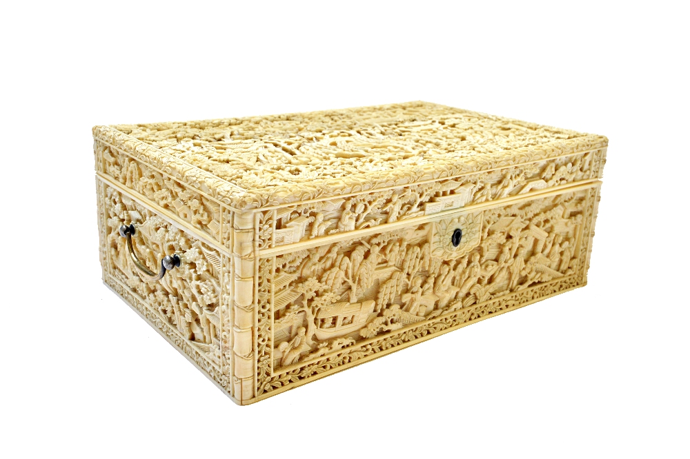 A good Canton ivory workbox, 19th century, of rectangular form set with two swing handles,