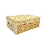 A good Canton ivory workbox, 19th century, of rectangular form set with two swing handles,