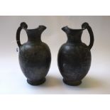 A pair of Etruscan Buchero jugs of reeded plain form (a.f), 31.5cm high (2).