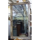 A 19th century French rectangular wall mirror with moulded frame about the two part mirror plate,