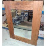 A 20th century rustic pine framed wall mirror.
