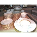 A Coalport dinner service with gilt edge rim.