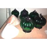Three green glass globular lamp shades,