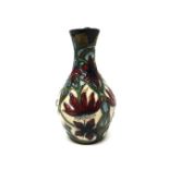 A small Moorcroft 'Passion Flower' vase, 2002, 14cm high, boxed.