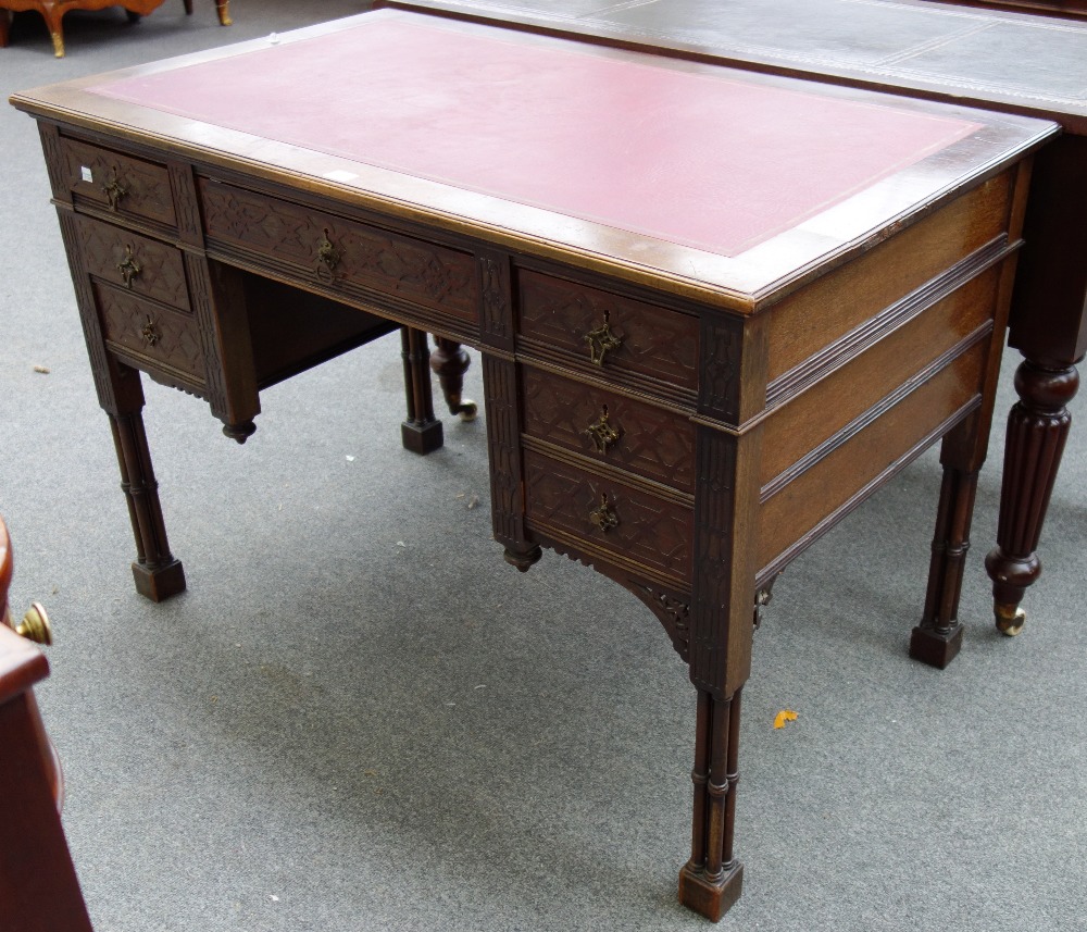 A late 19th century mahogany writing desk with seven drawers about the knee,