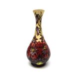 A Moorcroft 'Pascoe Flower' cream ground vase by Philip Gibson, circa 2000, 31cm high.