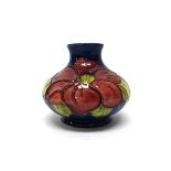 A small Moorcroft 'Anemone' blue ground vase, circa 1950, 7.5cm high, boxed.